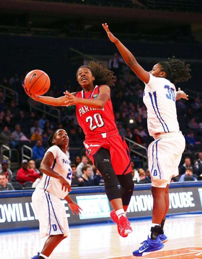 Apr 4, 2015; New York, NY, USA; Miami Country Day forward Kelsey Marshall (20) goes up for a shot while being defended by Dillard High School forward Ragene Grier (30) during the second half during the Dicks Sporting Goods High School Nationals girls final at Madison Square Garden. Miami defeated Dillard 57-41.  Mandatory Credit: Andy Marlin-USA TODAY Sports ORG XMIT: USATSI-224066 ORIG FILE ID:  2015044_jcd_bm4_028.JPG