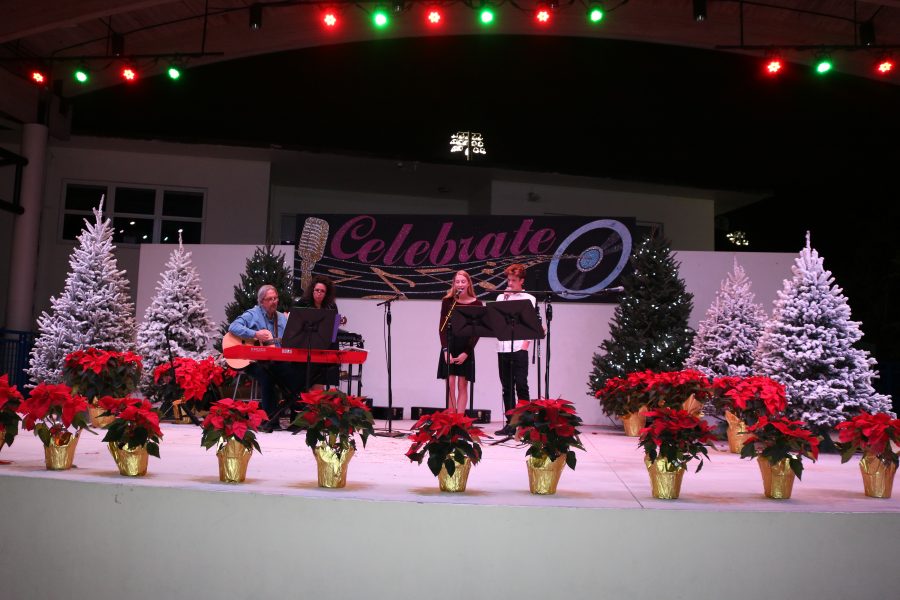 Music and holiday decorations fill the campus for the traditional Yule Log ceremony.